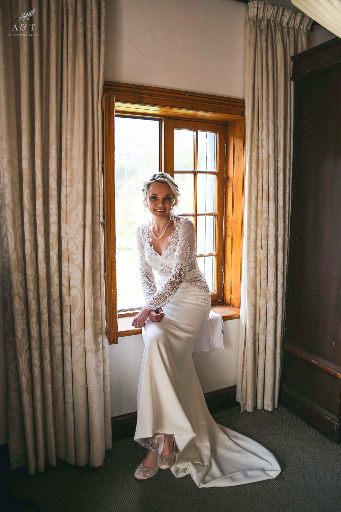 Crepe and lace sleeved weddinggown